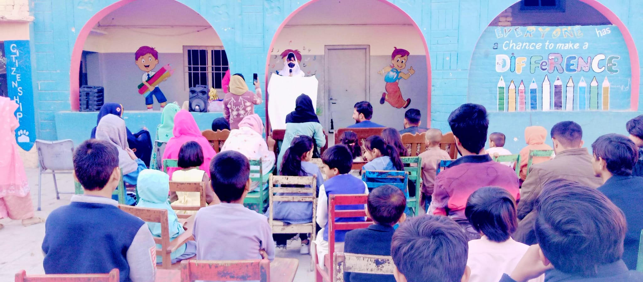 Children at a Mehrdar School courtyard event